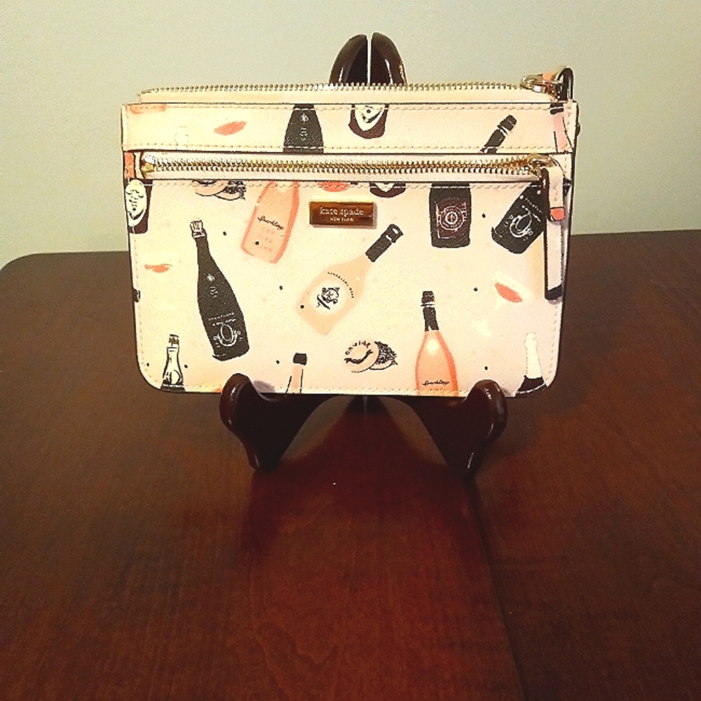 Kate Spade champagne zippered wristlet excellent condition ..
